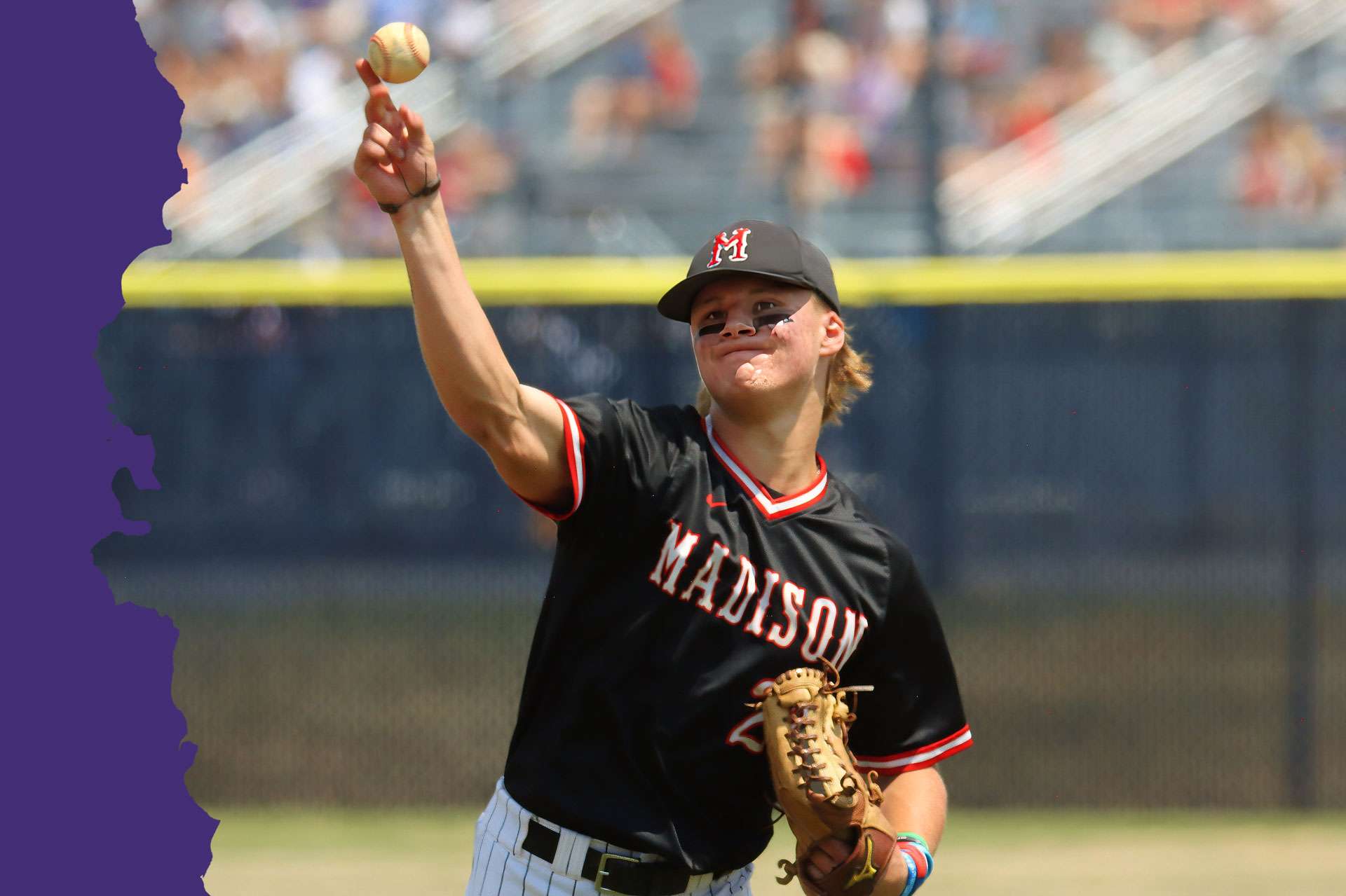 image of young man throwing a baseball